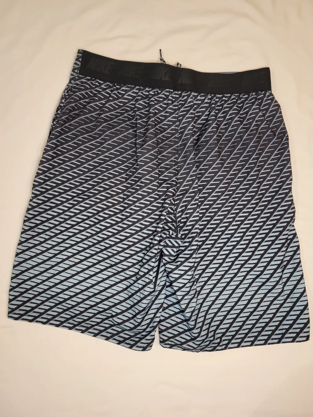 Nike Men's Blue and Black Diagonal Stripe Swim Trunks